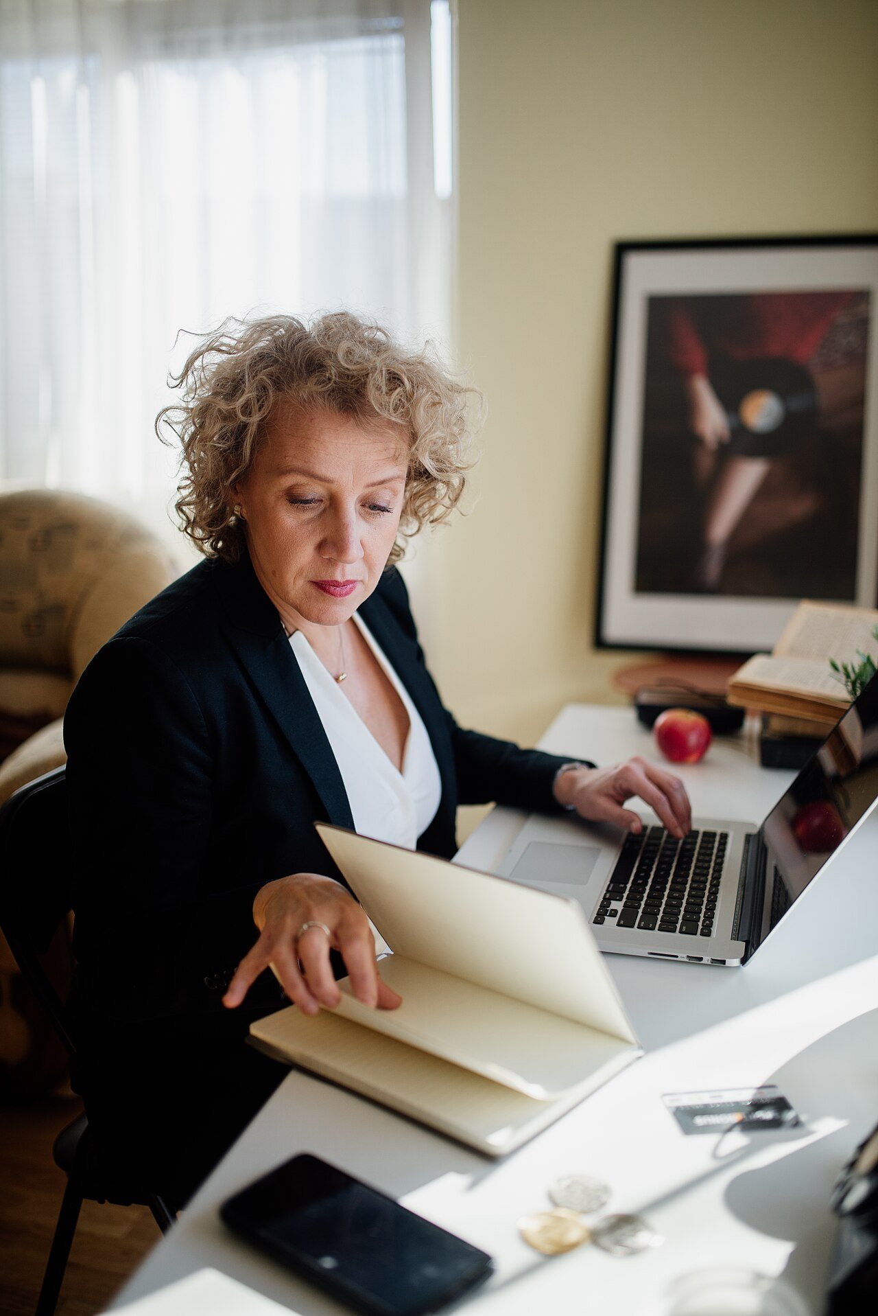 Corporate compliance documents and laptop used for business administration